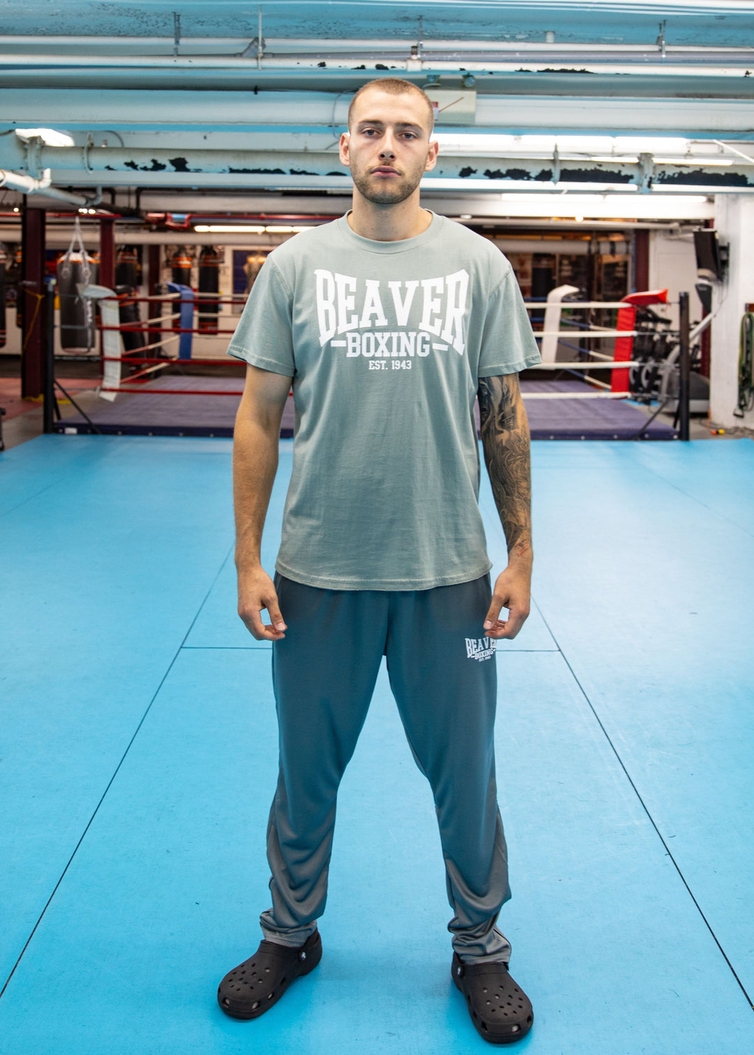 Man wearing a 'Beaver Boxing' t-shirt in a boxing ring.
